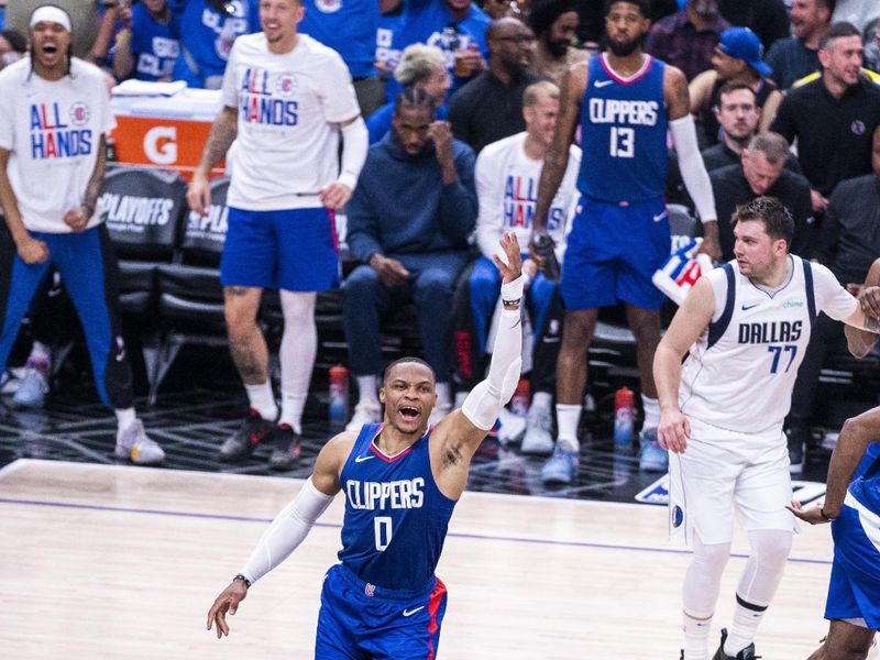 LOS ANGELES, CA - APRIL 21: Russell Westbrook #0 of the LA Clippers celebrates during the game against the Dallas Mavericks during the 2024 NBA Playoffs on April 21, 2024 at Crypto.Com Arena in Los Angeles, California. NOTE TO USER: User expressly acknowledges and agrees that, by downloading and/or using this Photograph, user is consenting to the terms and conditions of the Getty Images License Agreement. Mandatory Copyright Notice: Copyright 2024 NBAE (Photo by Tyler Ross/NBAE via Getty Images)