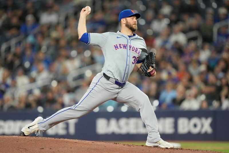 Sep 9, 2024; Toronto, Ontario, CAN; New York Mets starting pitcher Tylor Megill (38) pitches to the Toronto Blue Jays during the first inning at Rogers Centre. Mandatory Credit: John E. Sokolowski-Imagn Images