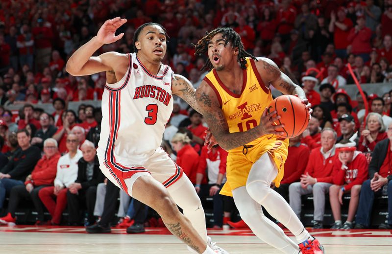 Feb 19, 2024; Houston, Texas, USA; Iowa State Cyclones guard Keshon Gilbert (10) drives with the ball as Houston Cougars guard Ramon Walker Jr. (3) defends during the first half at Fertitta Center. Mandatory Credit: Troy Taormina-USA TODAY Sports