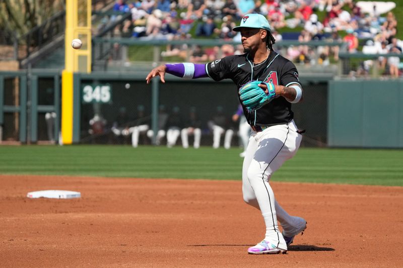 Mar 8, 2024; Salt River Pima-Maricopa, Arizona, USA; Arizona Diamondbacks second baseman Ketel Marte (4) makes the play against the Chicago Cubs for an out in the third inning at Salt River Fields at Talking Stick. Mandatory Credit: Rick Scuteri-USA TODAY Sports