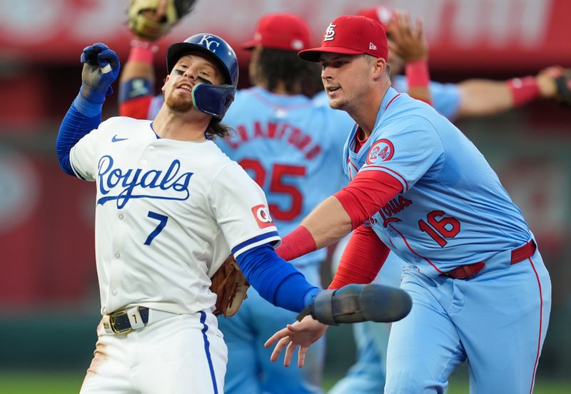 Aug 10, 2024; Kansas City, Missouri, USA; Kansas City Royals shortstop Bobby Witt Jr. (7) is caught in a rundown by St. Louis Cardinals second baseman Nolan Gorman (16) during the fifth inning at Kauffman Stadium. Mandatory Credit: Jay Biggerstaff-USA TODAY Sports