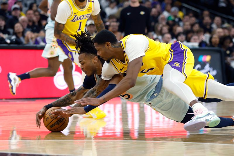 SAN ANTONIO, TEXAS - NOVEMBER 27: Stephon Castle #5 of the San Antonio Spurs and Cam Reddish #5 of the Los Angeles Lakers battle for the ball during the second quarter at Frost Bank Center on November 27, 2024 in San Antonio, Texas. NOTE TO USER: User expressly acknowledges and agrees that, by downloading and or using this photograph, User is consenting to the terms and conditions of the Getty Images License Agreement (Photo by Ronald Cortes/Getty Images)