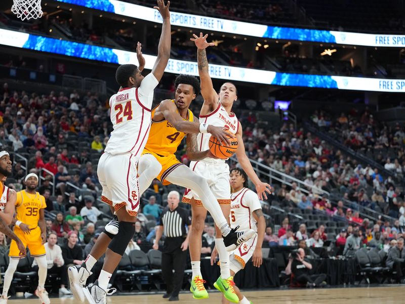 Mar 9, 2023; Las Vegas, NV, USA; Arizona State Sun Devils guard Desmond Cambridge Jr. (4) looks to pass the ball between USC Trojans forward Joshua Morgan (24) and USC Trojans forward Kobe Johnson (0) during the first half at T-Mobile Arena. Mandatory Credit: Stephen R. Sylvanie-USA TODAY Sports