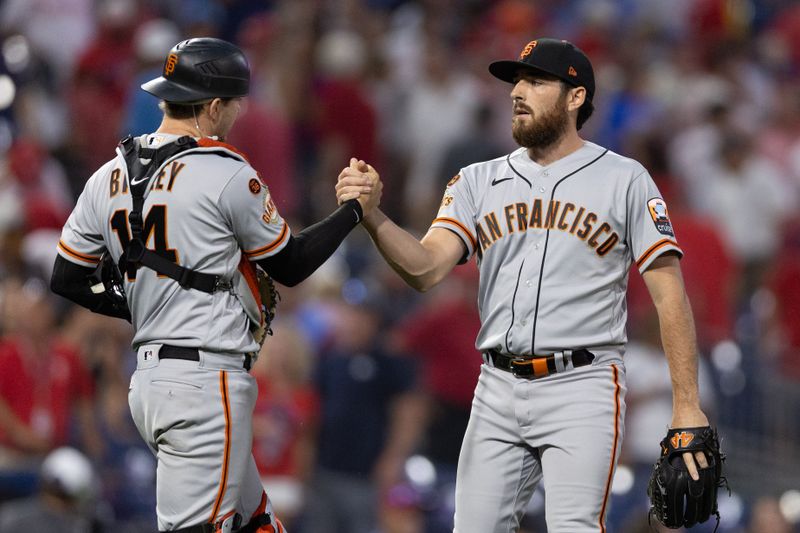 Aug 23, 2023; Philadelphia, Pennsylvania, USA; San Francisco Giants pitcher Ryan Walker (R) and catcher Patrick Bailey (14) shake hands after a victory against the Philadelphia Phillies at Citizens Bank Park. Mandatory Credit: Bill Streicher-USA TODAY Sports