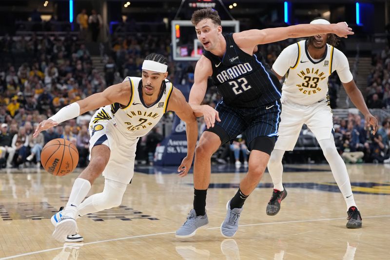 INDIANAPOLIS, INDIANA - NOVEMBER 06: Andrew Nembhard #2 of the Indiana Pacers dribbles the ball while being guarded by Franz Wagner #22 of the Orlando Magic in the third quarter at Gainbridge Fieldhouse on November 06, 2024 in Indianapolis, Indiana. NOTE TO USER: User expressly acknowledges and agrees that, by downloading and or using this photograph, User is consenting to the terms and conditions of the Getty Images License Agreement. (Photo by Dylan Buell/Getty Images)