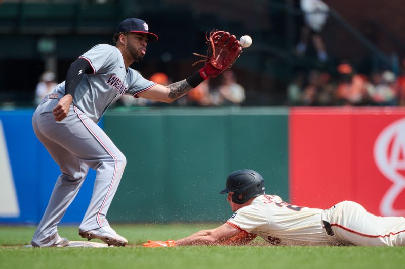 Apr 10, 2024; San Francisco, California, USA; San Francisco Giants third baseman Matt Chapman (26) steals second base against Washington Nationals second baseman Luis Garcia Jr. (2) during the sixth inning at Oracle Park. Mandatory Credit: Robert Edwards-USA TODAY Sports