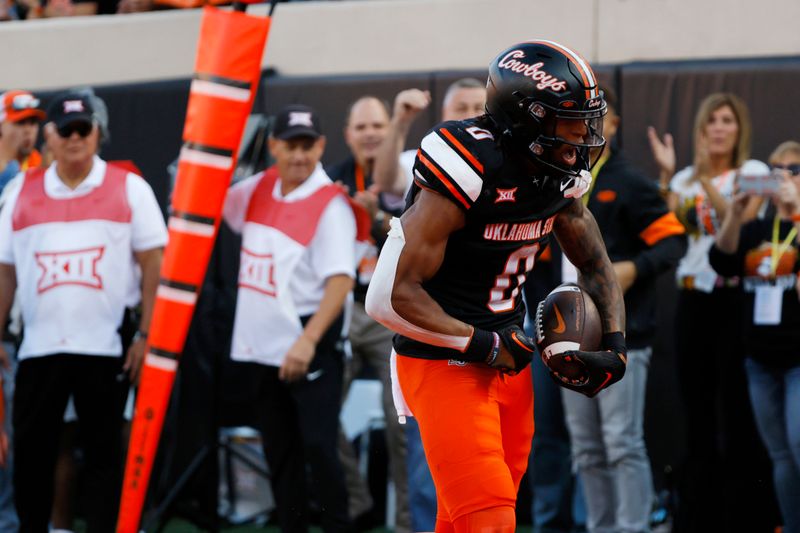 Nov 4, 2023; Stillwater, Oklahoma, USA; Oklahoma State Cowboys running back Ollie Gordon II (0) celebrates after a run during a Bedlam college football game between the Oklahoma State University Cowboys (OSU) and the University of Oklahoma Sooners (OU) at Boone Pickens Stadium. Mandatory Credit: Bryan Terry-USA TODAY Sports