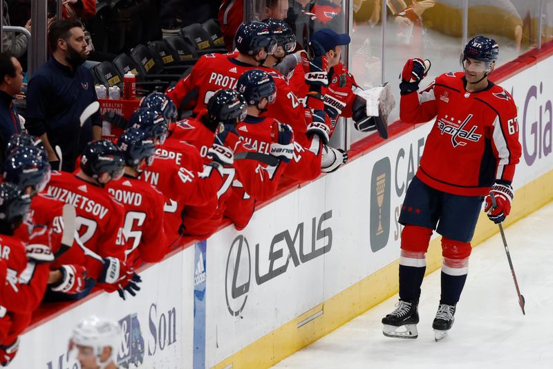 Jan 11, 2024; Washington, District of Columbia, USA; Washington Capitals left wing Max Pacioretty (67) celebrates with teammates after scoring a goal against the Seattle Kraken in the second period at Capital One Arena. Mandatory Credit: Geoff Burke-USA TODAY Sports