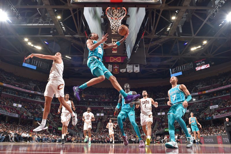 CLEVELAND, OH - APRIL 14: Nick Smith Jr. #8 of the Charlotte Hornets drives to the basket during the game against the Cleveland Cavaliers on April 14, 2024 at Rocket Mortgage FieldHouse in Cleveland, Ohio. NOTE TO USER: User expressly acknowledges and agrees that, by downloading and/or using this Photograph, user is consenting to the terms and conditions of the Getty Images License Agreement. Mandatory Copyright Notice: Copyright 2024 NBAE (Photo by David Liam Kyle/NBAE via Getty Images)