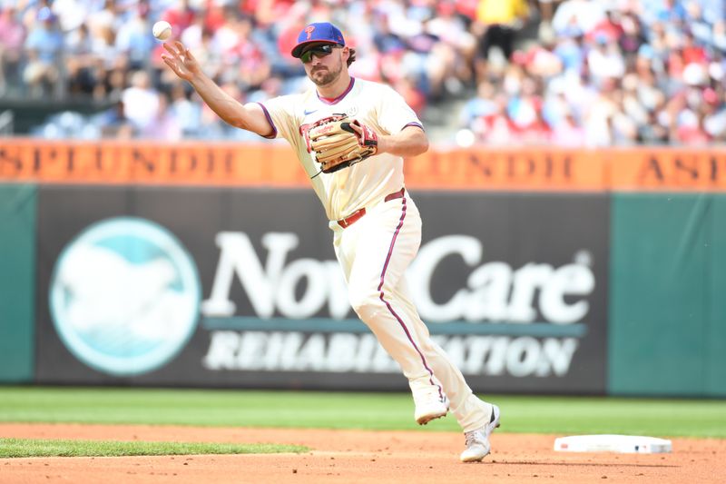 Sep 15, 2024; Philadelphia, Pennsylvania, USA; Philadelphia Phillies second base Buddy Kennedy (19) throws to first base during the second inning against the New York Mets at Citizens Bank Park. Mandatory Credit: Eric Hartline-Imagn Images