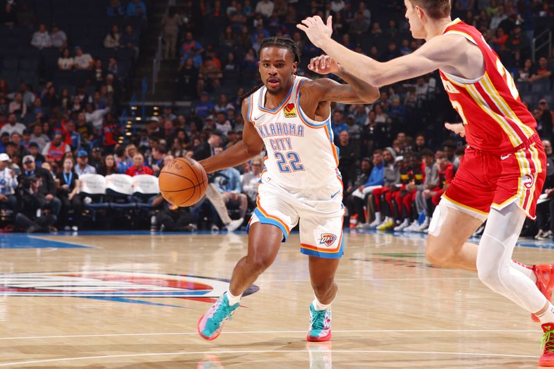 OKLAHOMA CITY, OK - OCTOBER 17: Cason Wallace #22 of the Oklahoma City Thunder dribbles the ball during the game against the Atlanta Hawks  on October 17, 2024 at Paycom Arena in Oklahoma City, Oklahoma. NOTE TO USER: User expressly acknowledges and agrees that, by downloading and or using this photograph, User is consenting to the terms and conditions of the Getty Images License Agreement. Mandatory Copyright Notice: Copyright 2024 NBAE (Photo by Zach Beeker/NBAE via Getty Images)