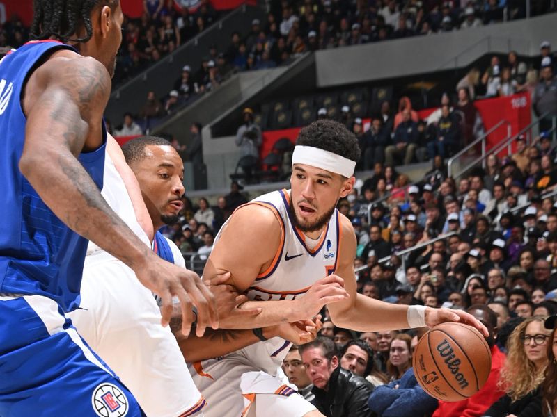 LOS ANGELES, CA - JANUARY 8: Devin Booker #1 of the Phoenix Suns dribbles the ball during the game against the LA Clippers on January 8, 2024 at Crypto.Com Arena in Los Angeles, California. NOTE TO USER: User expressly acknowledges and agrees that, by downloading and/or using this Photograph, user is consenting to the terms and conditions of the Getty Images License Agreement. Mandatory Copyright Notice: Copyright 2024 NBAE (Photo by Andrew D. Bernstein/NBAE via Getty Images)