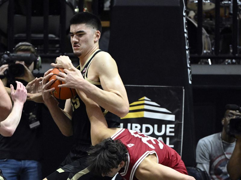 Feb 25, 2023; West Lafayette, Indiana, USA; Purdue Boilermakers center Zach Edey (15) and Indiana Hoosiers guard Trey Galloway (32) fight for a rebound during the first half at Mackey Arena. Mandatory Credit: Marc Lebryk-USA TODAY Sports