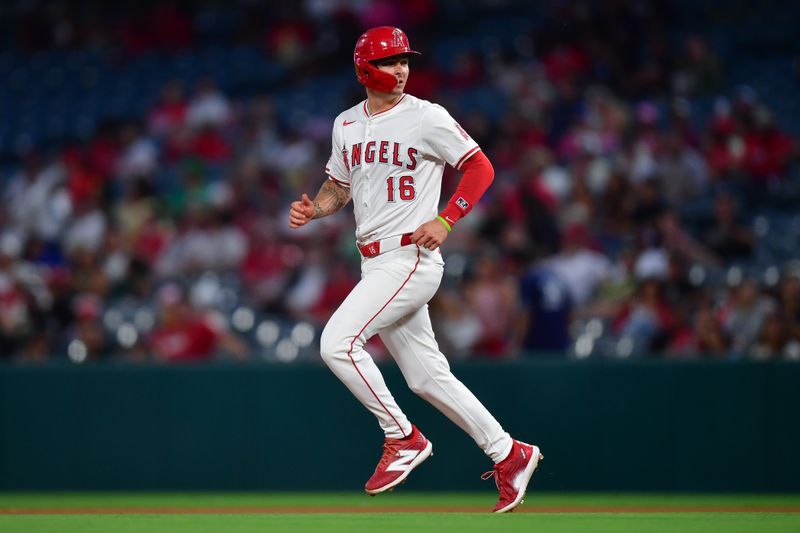 Jun 25, 2024; Anaheim, California, USA; Los Angeles Angels center fielder Mickey Moniak (16) reaches second on a wild pitch by Oakland Athletics pitcher Mitch Spence (40) during the sixth inning at Angel Stadium. Mandatory Credit: Gary A. Vasquez-USA TODAY Sports