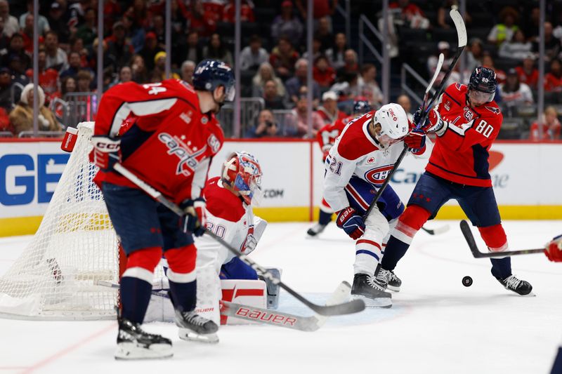 Oct 31, 2024; Washington, District of Columbia, USA; Washington Capitals left wing Pierre-Luc Dubois (80) and Montreal Canadiens defenseman Kaiden Guhle (21) battle for the puck in front of Canadiens goaltender Cayden Primeau (30) in the third period at Capital One Arena. Mandatory Credit: Geoff Burke-Imagn Images