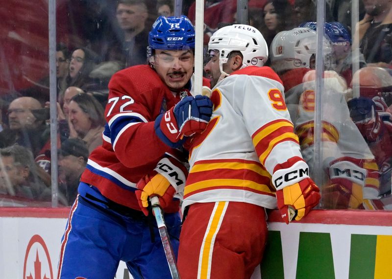 Nov 14, 2023; Montreal, Quebec, CAN; Montreal Canadiens defenseman Arber Xhekaj (72) checks Calgary Flames forward Nazem Kadri (91) during the second period at the Bell Centre. Mandatory Credit: Eric Bolte-USA TODAY Sports