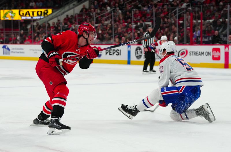 Dec 28, 2023; Raleigh, North Carolina, USA; Carolina Hurricanes right wing Andrei Svechnikov (37) scores goal on his shot against the Montreal Canadiens during the third period at PNC Arena. Mandatory Credit: James Guillory-USA TODAY Sports