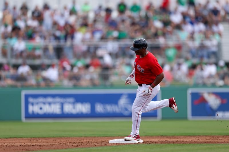 Mar 17, 2024; Fort Myers, Florida, USA;  Boston Red Sox third baseman Rafael Devers (11) runs the bases after hitting a two-run home run against the New York Yankees in the first inning at JetBlue Park at Fenway South. Mandatory Credit: Nathan Ray Seebeck-USA TODAY Sports