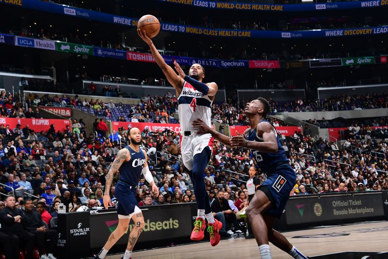 LOS ANGELES, CA - MARCH 1: Jared Butler #4 of the Washington Wizards drives to the basket during the game against the LA Clippers on March 1, 2024 at Crypto.Com Arena in Los Angeles, California. NOTE TO USER: User expressly acknowledges and agrees that, by downloading and/or using this Photograph, user is consenting to the terms and conditions of the Getty Images License Agreement. Mandatory Copyright Notice: Copyright 2024 NBAE (Photo by Adam Pantozzi/NBAE via Getty Images)