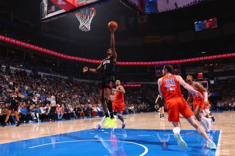 OKLAHOMA CITY, OK - MARCH 27:  Amen Thompson #1 of the Houston Rockets drives to the basket during the game against the Oklahoma City Thunder on March 27, 2024 at Paycom Arena in Oklahoma City, Oklahoma. NOTE TO USER: User expressly acknowledges and agrees that, by downloading and or using this photograph, User is consenting to the terms and conditions of the Getty Images License Agreement. Mandatory Copyright Notice: Copyright 2024 NBAE (Photo by Zach Beeker/NBAE via Getty Images)