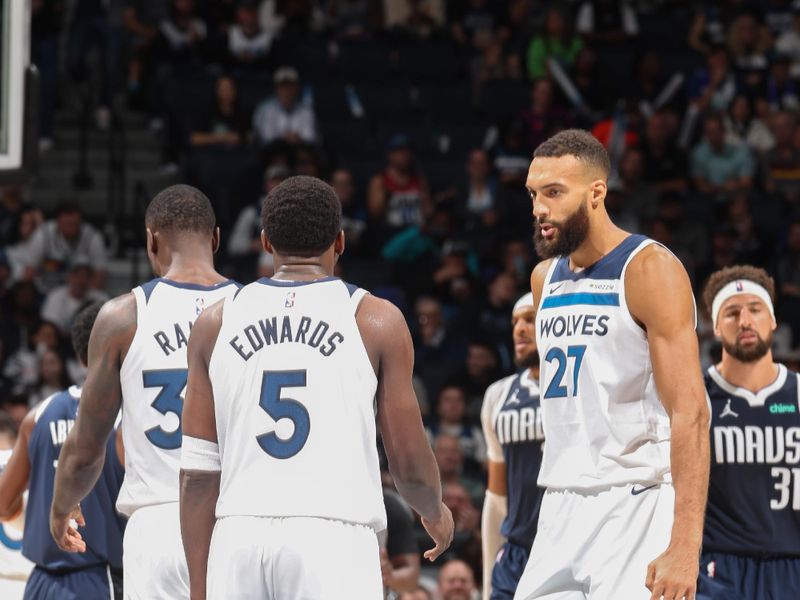 MINNEAPOLIS, MN -  OCTOBER 29: Anthony Edwards #5 and Rudy Gobert #27 of the Minnesota Timberwolves talk during the game against the Dallas Mavericks on October 29, 2024 at Target Center in Minneapolis, Minnesota. NOTE TO USER: User expressly acknowledges and agrees that, by downloading and or using this Photograph, user is consenting to the terms and conditions of the Getty Images License Agreement. Mandatory Copyright Notice: Copyright 2024 NBAE (Photo by David Sherman/NBAE via Getty Images)