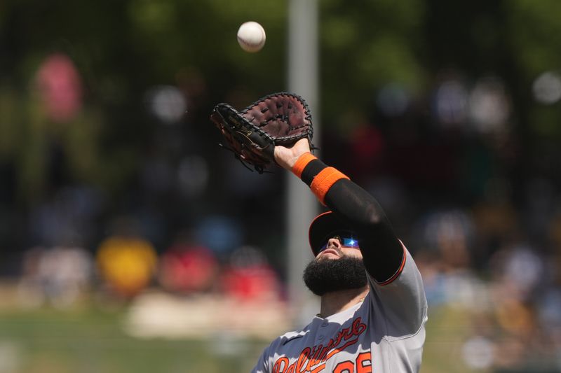 Jun 8, 2025; West Sacramento, California, USA; Baltimore Orioles first baseman Emmanuel Rivera (26) catches a fly ball against the Athletics during the third inning at Sutter Health Park. Mandatory Credit: Darren Yamashita-Imagn Images