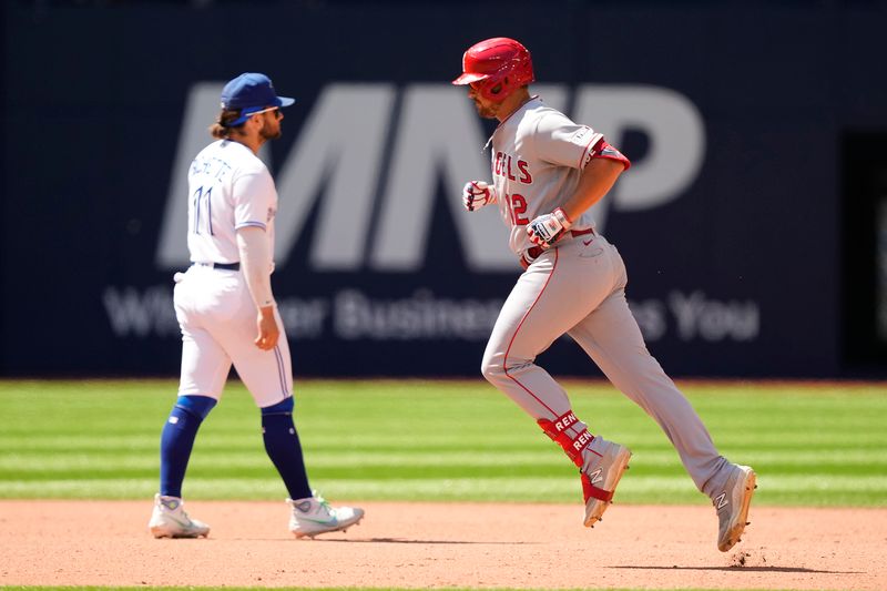 Jul 30, 2023; Toronto, Ontario, CAN; Los Angeles Angels right fielder Hunter Renfroe (12) runs to third on his game winning two run home run during the tenth inning against the Toronto Blue Jays at Rogers Centre. Mandatory Credit: John E. Sokolowski-USA TODAY Sports