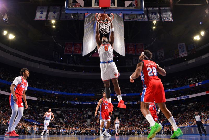 PHILADELPHIA, PA - NOVEMBER 12: OG Anunoby #8 of the New York Knicks dunks the ball during the game against the Philadelphia 76ers during the Emirates NBA Cup game on November 12, 2024 at the Wells Fargo Center in Philadelphia, Pennsylvania NOTE TO USER: User expressly acknowledges and agrees that, by downloading and/or using this Photograph, user is consenting to the terms and conditions of the Getty Images License Agreement. Mandatory Copyright Notice: Copyright 2024 NBAE (Photo by Jesse D. Garrabrant/NBAE via Getty Images)