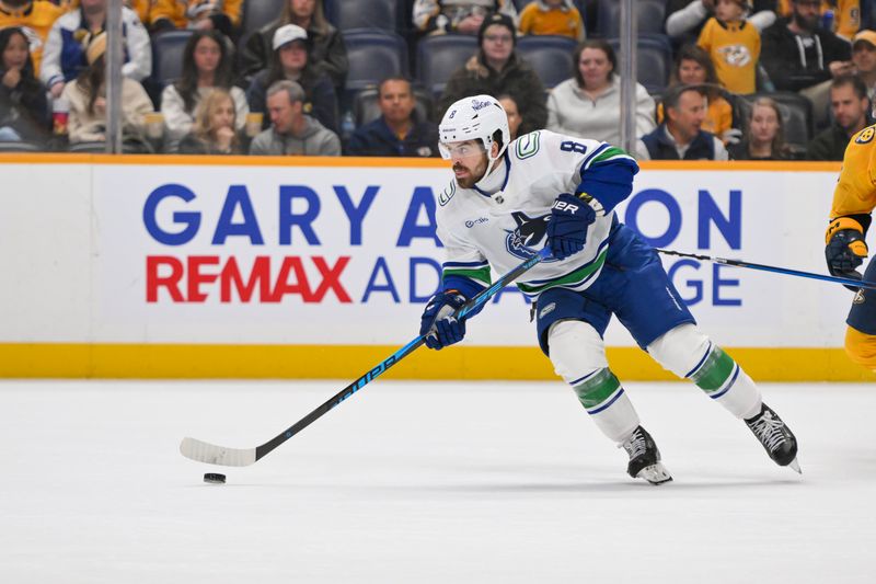Oct 23, 2025; Nashville, Tennessee, USA;  Vancouver Canucks right wing Conor Garland (8) skates with the puck against the Nashville Predators during the third period at Bridgestone Arena. Mandatory Credit: Steve Roberts-Imagn Images