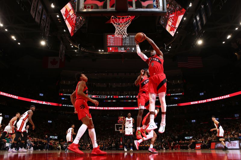 TORONTO, CANADA - JANUARY 17: RJ Barrett #9 of the Toronto Raptors rebounds the ball during the game against the Miami Heat on January 17, 2024 at the Scotiabank Arena in Toronto, Ontario, Canada.  NOTE TO USER: User expressly acknowledges and agrees that, by downloading and or using this Photograph, user is consenting to the terms and conditions of the Getty Images License Agreement.  Mandatory Copyright Notice: Copyright 2024 NBAE (Photo by Vaughn Ridley/NBAE via Getty Images)