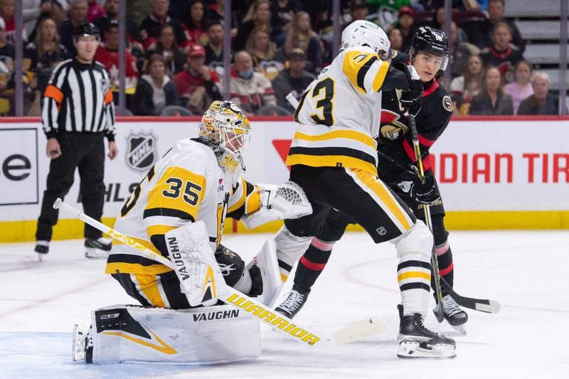 Mar12, 2024; Ottawa, Ontario, CAN; Pittsburgh Penguins defenseman Piere-Olivier Joseph (73) defends against Ottawa Senators center Tim Stutzle (18) in the first period at the Canadian Tire Centre. Mandatory Credit: Marc DesRosiers-USA TODAY Sports