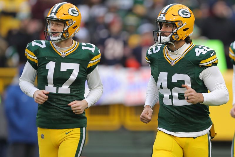 Green Bay Packers place kicker Anders Carlson (17) and Green Bay Packers long snapper Matt Orzech (42) prior to an NFL football game against the Chicago Bears, Sunday, Jan. 07, 2024, in Green Bay. (AP Photo/Melissa Tamez)