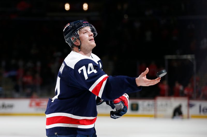 Jan 7, 2024; Washington, District of Columbia, USA; Washington Capitals defenseman John Carlson (74) throws a puck into the stands after winning the first star of the game against the Los Angeles Kings at Capital One Arena. Mandatory Credit: Amber Searls-USA TODAY Sports