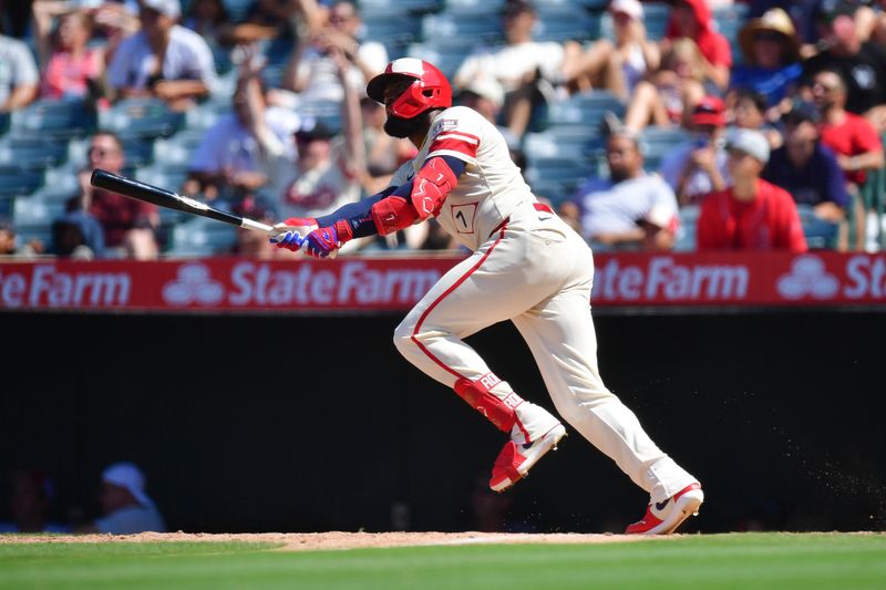 Jul 14, 2024; Anaheim, California, USA; Los Angeles Angels right fielder Jo Adell (7) hits a three run home run against the Seattle Mariners during the eighth inning at Angel Stadium. Mandatory Credit: Gary A. Vasquez-USA TODAY Sports