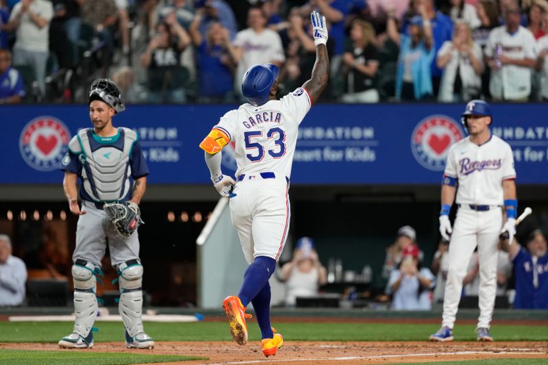 Apr 24, 2024; Arlington, Texas, USA; Texas Rangers right fielder Adolis García (53) gestures as he crosses home plate on his solo home run against the Seattle Mariners during the fourth inning at Globe Life Field. Mandatory Credit: Jim Cowsert-USA TODAY Sports