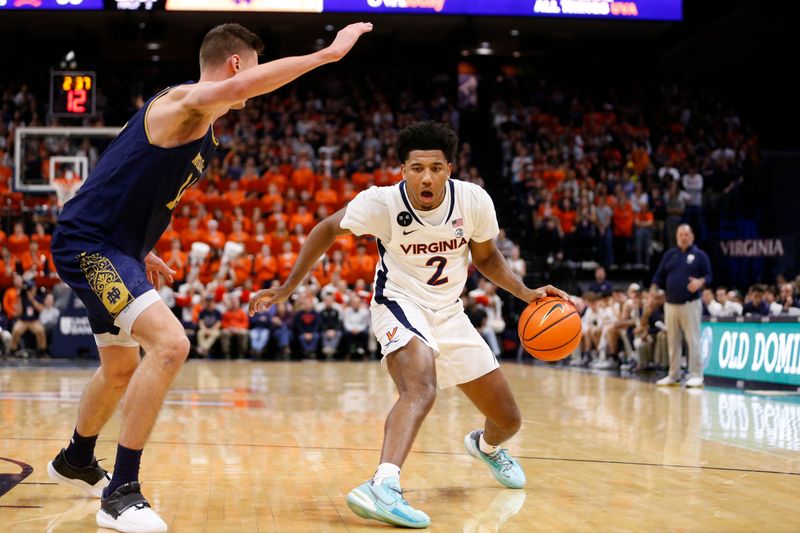 Feb 18, 2023; Charlottesville, Virginia, USA; Virginia Cavaliers guard Reece Beekman (2) controls the ball as Notre Dame Fighting Irish forward Nate Laszewski (14) defends during the second half at John Paul Jones Arena. Mandatory Credit: Amber Searls-USA TODAY Sports