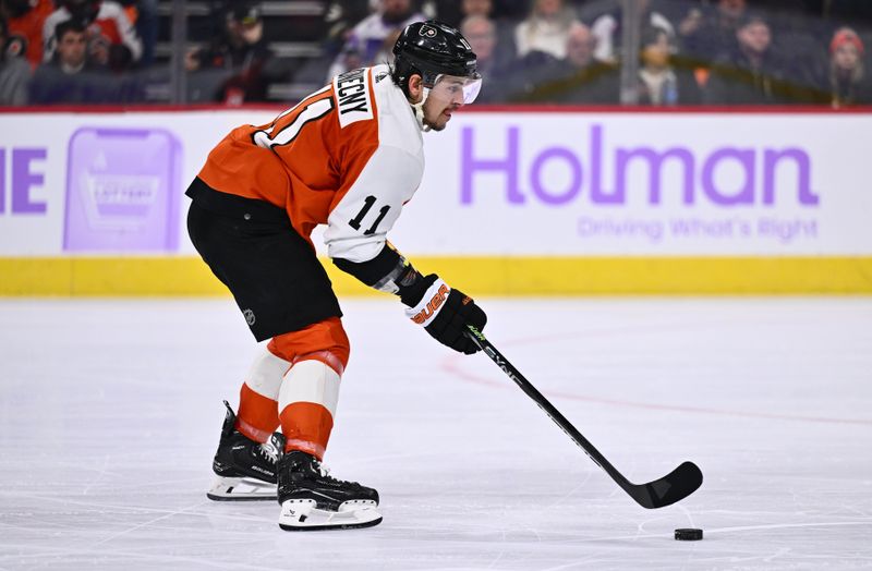 Nov 28, 2023; Philadelphia, Pennsylvania, USA; Philadelphia Flyers right wing Travis Konecny (11) carries the puck on a breakaway to score a goal against the Carolina Hurricanes in the second period at Wells Fargo Center. Mandatory Credit: Kyle Ross-USA TODAY Sports