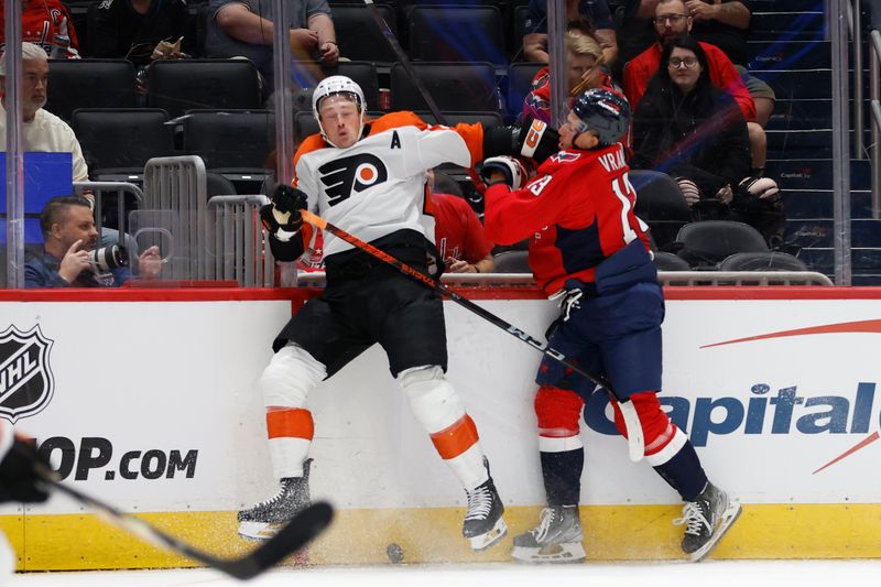 Sep 22, 2024; Washington, District of Columbia, USA; Washington Capitals forward Jakub Vrana (13) checks Philadelphia Flyers forward Nick Seeler (24) while battling for the puck in the first period at Capital One Arena. Mandatory Credit: Geoff Burke-Imagn Images