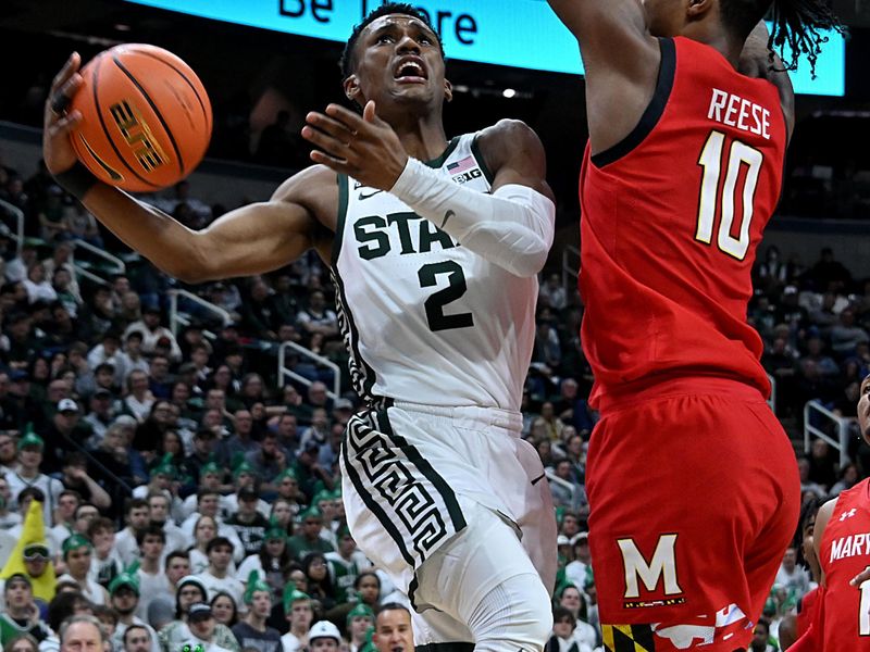 Feb 7, 2023; East Lansing, Michigan, USA; Michigan State Spartans guard Tyson Walker (2) drives to the basket against Maryland Terrapins forward Julian Reese (10) in the second half at Jack Breslin Student Events Center. Mandatory Credit: Dale Young-USA TODAY Sports