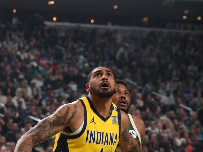 MILWAUKEE, WI - APRIL 21: Obi Toppin #1 of the Indiana Pacers and Malik Beasley #5 of the Milwaukee Bucks wait for a rebound during the game during Round 1 Game 1 of the 2024 NBA Playoffs on April 21, 2024 at the Fiserv Forum Center in Milwaukee, Wisconsin. NOTE TO USER: User expressly acknowledges and agrees that, by downloading and or using this Photograph, user is consenting to the terms and conditions of the Getty Images License Agreement. Mandatory Copyright Notice: Copyright 2024 NBAE (Photo by Gary Dineen/NBAE via Getty Images).