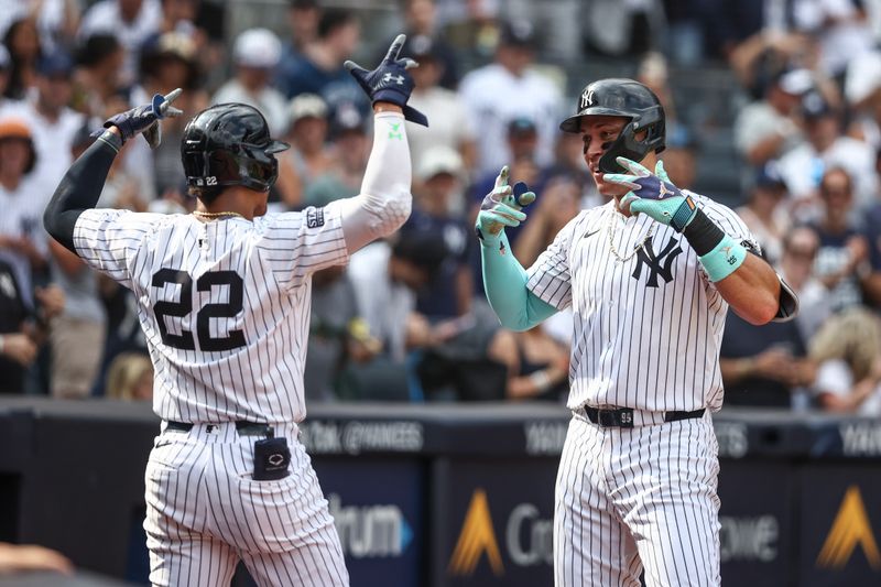 Aug 25, 2024; Bronx, New York, USA;  New York Yankees center fielder Aaron Judge (99) celebrates with right fielder Juan Soto (22) after hitting a solo home run in the seventh inning against the Colorado Rockies at Yankee Stadium. Mandatory Credit: Wendell Cruz-USA TODAY Sports