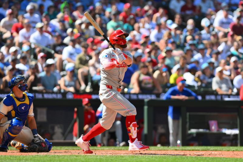 Aug 4, 2024; Seattle, Washington, USA; Philadelphia Phillies first baseman Bryce Harper (3) hits a home run against the Seattle Mariners during the eighth inning at T-Mobile Park. Mandatory Credit: Steven Bisig-USA TODAY Sports