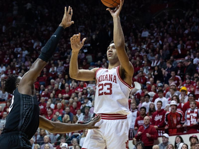 Jan 22, 2023; Bloomington, Indiana, USA; Indiana Hoosiers forward Trayce Jackson-Davis (23) shoots the ball while Michigan State Spartans center Mady Sissoko (22) defends in the first half at Simon Skjodt Assembly Hall. Mandatory Credit: Trevor Ruszkowski-USA TODAY Sports