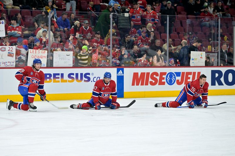 Feb 11, 2024; Montreal, Quebec, CAN; Montreal Canadiens forward Joshua Roy (89) stretches with teammate defenseman Jayden Struble (47) and forward Tanner Pearson (70) during the warmup period before the game against the St.Louis Blues at the Bell Centre. Mandatory Credit: Eric Bolte-USA TODAY Sports