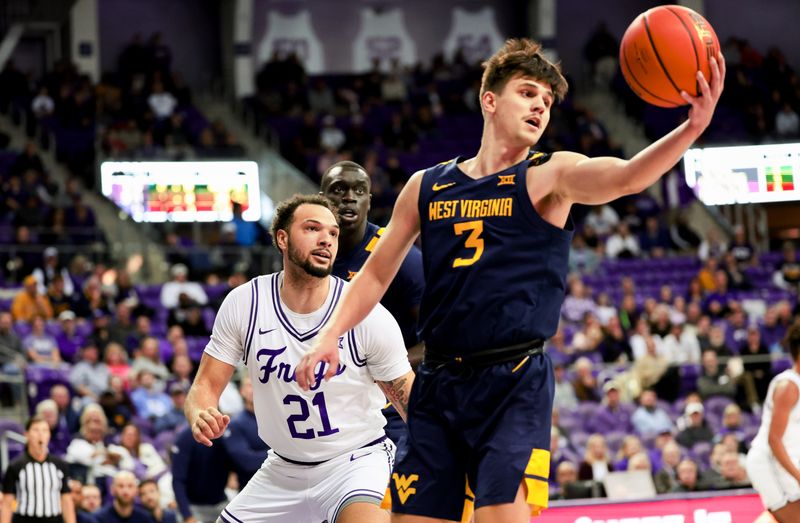 Feb 12, 2024; Fort Worth, Texas, USA;  West Virginia Mountaineers guard Kerr Kriisa (3) grabs the ball away from TCU Horned Frogs forward JaKobe Coles (21) during the first half at Ed and Rae Schollmaier Arena. Mandatory Credit: Kevin Jairaj-USA TODAY Sports