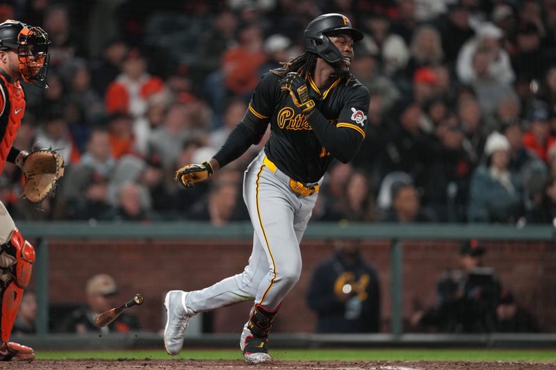 Apr 26, 2024; San Francisco, California, USA; Pittsburgh Pirates shortstop Oneil Cruz (15) hits a single against the San Francisco Giants during the ninth inning at Oracle Park. Mandatory Credit: Darren Yamashita-USA TODAY Sports