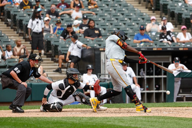 Jul 14, 2024; Chicago, Illinois, USA; Pittsburgh Pirates shortstop Oneil Cruz (15) singles against the Chicago White Sox during the seventh inning at Guaranteed Rate Field. Mandatory Credit: Kamil Krzaczynski-USA TODAY Sports