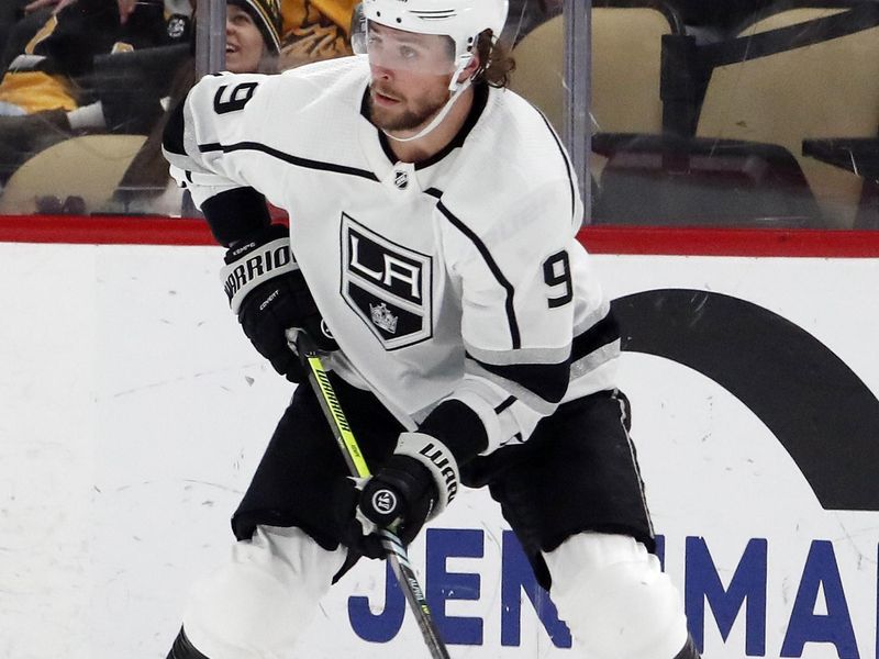 Feb 18, 2024; Pittsburgh, Pennsylvania, USA;  Los Angeles Kings right wing Adrian Kempe (9) handles the puck against the Pittsburgh Penguins during the third period at PPG Paints Arena. Los Angeles won 2-1. Mandatory Credit: Charles LeClaire-USA TODAY Sports