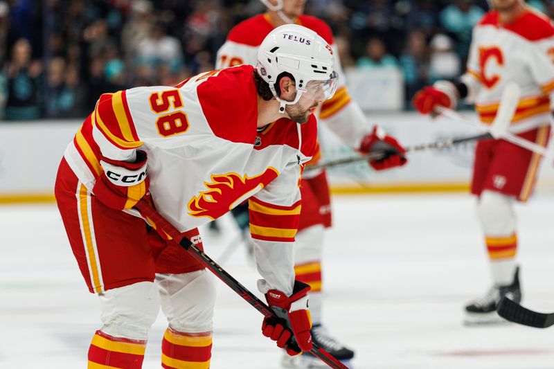 Oct 19, 2024; Seattle, Washington, USA; Calgary Flames center Justin Kirkland (58) warms up before the game against the Seattle Kraken at Climate Pledge Arena. Mandatory Credit: Caean Couto-Imagn Images