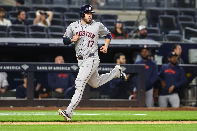 May 7, 2024; Bronx, New York, USA;  Houston Astros catcher Victor Caratini (17) runs to home in the ninth inning against the New York Yankees at Yankee Stadium. Mandatory Credit: Wendell Cruz-USA TODAY Sports